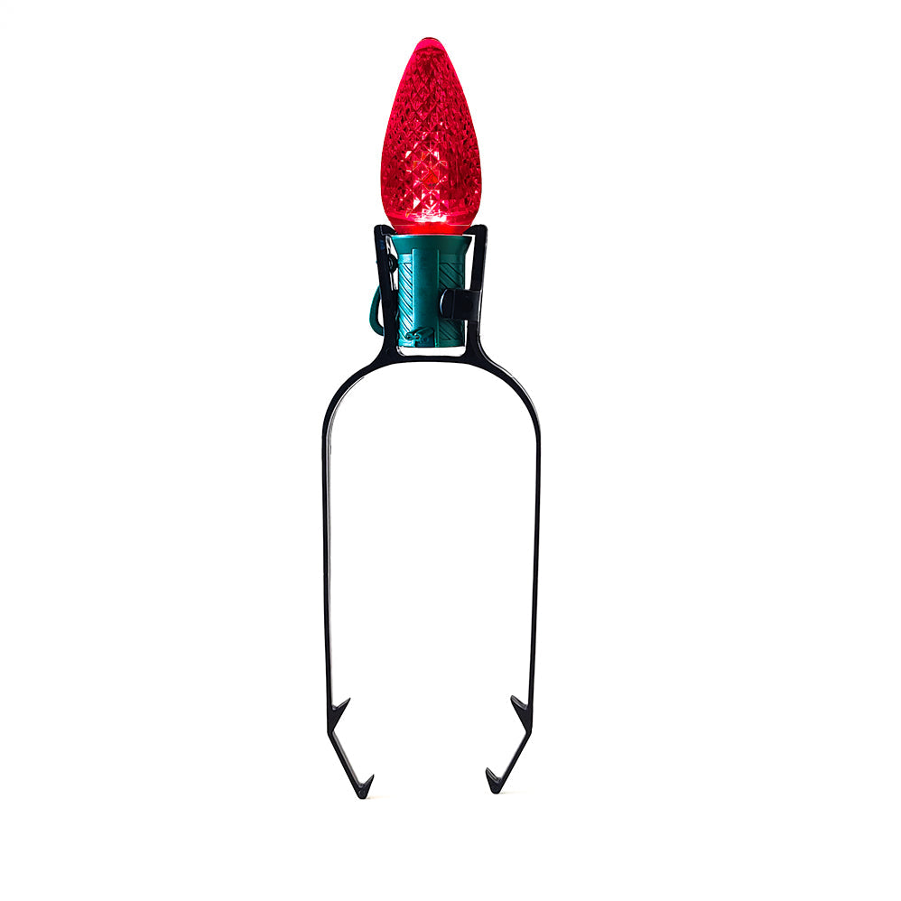 Red Christmas light bulb on a white background